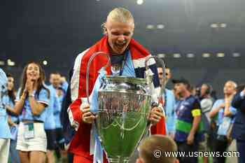 Soccer-Jubilant Man City Hang Tough to Beat Inter and Complete the Treble