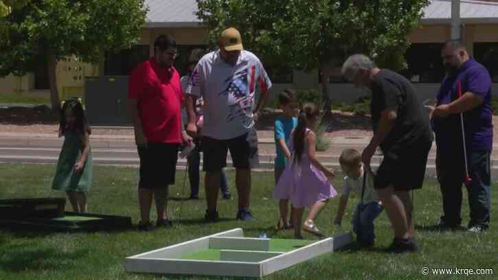 Dads accompany their little ones at Rio Rancho mini golf event