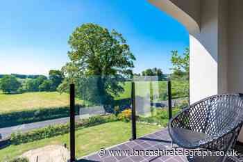 Great gardens with a stream are highlights of this Waddington home
