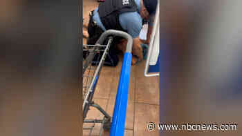 Video shows a man held down by police in a Kansas City Walmart