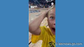 WATCH:  Woman makes half-court shot to win free beer