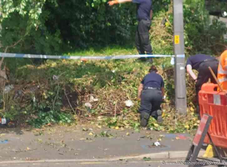 Blackburn murder: Police forensic teams searching land off main road