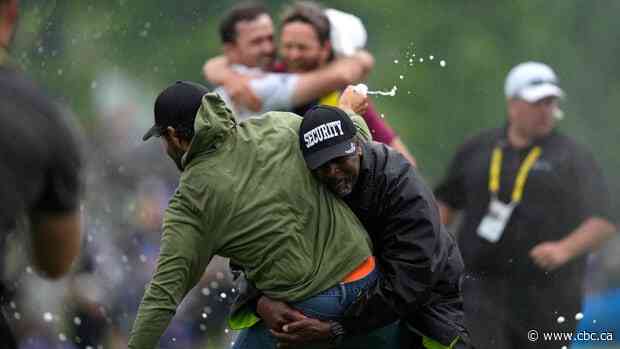 Adam Hadwin rushed to celebrate Nick Taylor's Canadian Open win with champagne, but security had other ideas