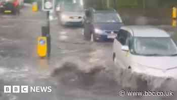 London flooding: Cars push through waterlogged streets