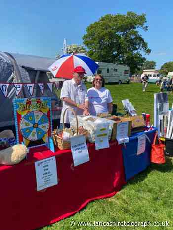 Volunteers help Rosemere Cancer Foundation with steam fair stand