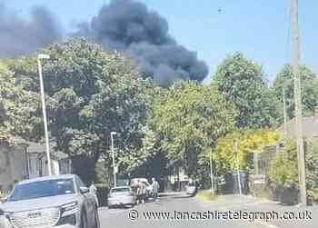 15 homes evacuated as firefighters tackle blaze in garage
