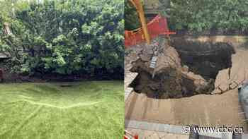 Sinkhole in Regina backyard caused by collapsed 1940s stormwater pipe