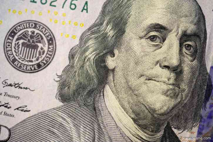 Fed keeps rates unchanged for first time in 15 months but signals 2 more potential hikes this year