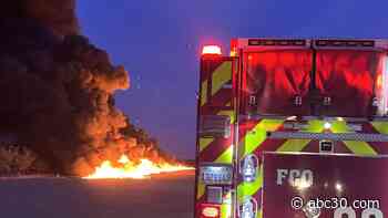 Firefighters working to contain large fire in Fresno County