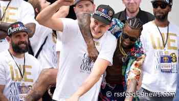 Jokic, originally unenthusiastic, has a blast at the Nuggets parade