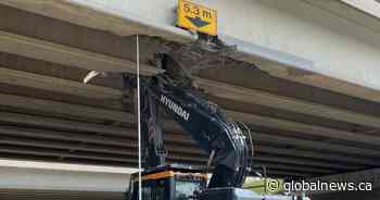 Semi collision damages Whitemud overpass at southeast Edmonton Henday interchange