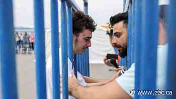 Brothers reunite after migrant ship capsizes, bringing a brief reprieve from grief in Greece