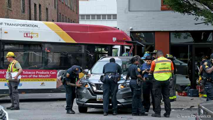 16 injured as Baltimore bus crashes into 2 cars, building