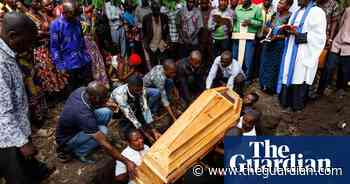 Families in Uganda bury their dead after school massacre