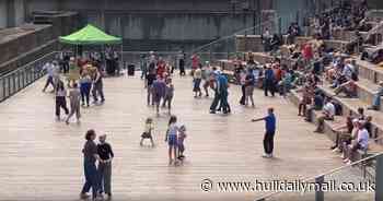 The heartwarming moment dozens start dancing at the dock in Hull on Father's Day