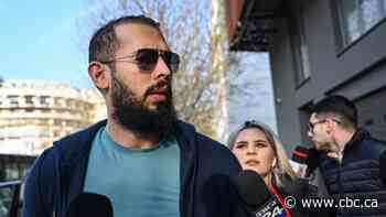 Andrew Tate charged with rape, human trafficking in Romania