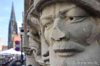 Steinköpfe der Täufer vor dem Rathaus beschädigt