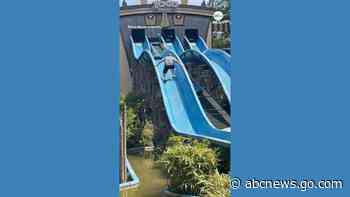WATCH:  Dad scales waterslide to help his stuck daughter