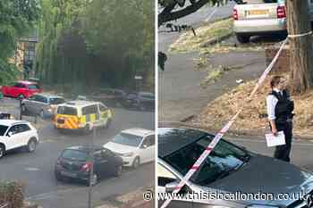 Police officers set cordon in Barry Road, Stonebridge