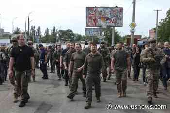Ukraine's Zelenskiy: Russia Is Hiding Bodies of Victims of Dam Breach