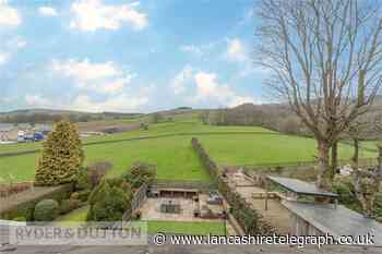 This stunning home has a balcony with great views of the countryside