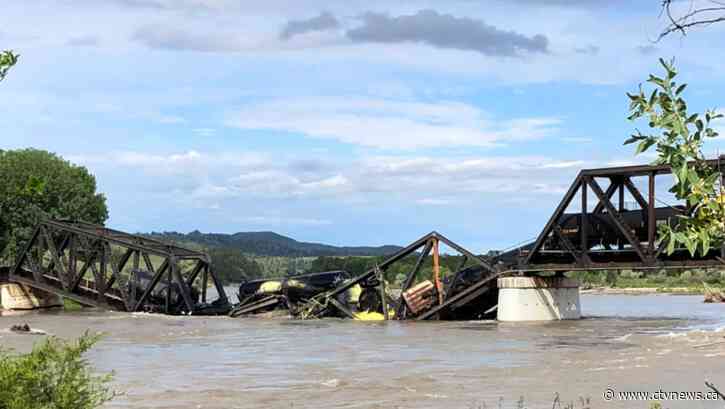 Freight train carrying hot asphalt, molten sulfur plunges into Yellowstone River as bridge fails