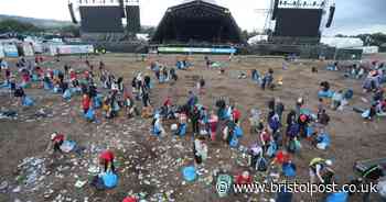 Glastonbury Festival-goers leave sea of rubbish in front of the Pyramid stage as huge clean-up begins
