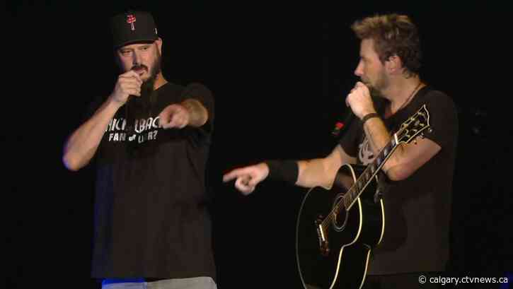 CJAY 92 Nickelback contest winner joins band live on stage in Calgary