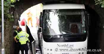 Road and rail disruption as bus gets stuck under Metro bridge in Gateshead