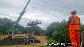 Steady does it! Canal bridge lowered into place at Greenford
