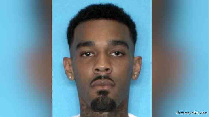 Police arrest man who held woman at gunpoint, shot through door after she pushed him out of house