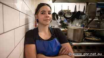 Erica works hard as a dishwasher — but the return of work limits for international students could mean a loss of hours