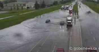 Flooded streets, power outages reported in Calgary after storm passes through