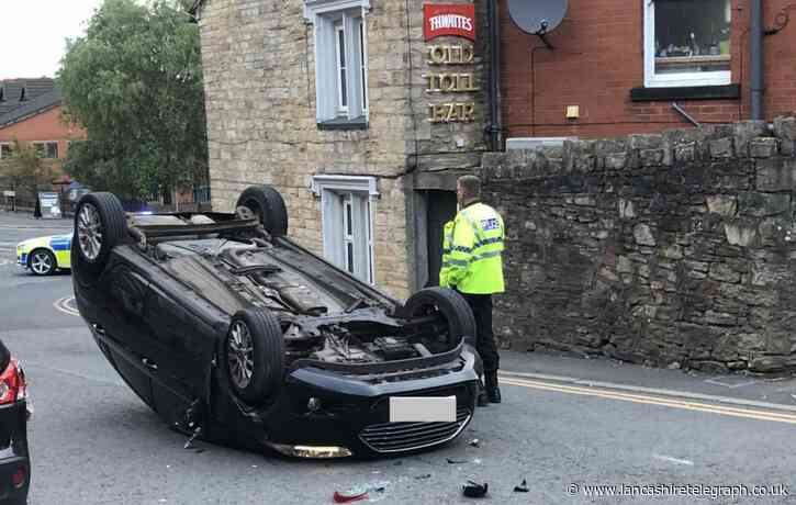 Driver arrested after car overturns near pub in Blackburn