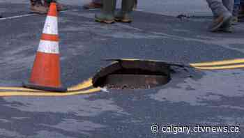 Sinkholes close road in northwest Calgary