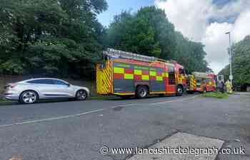 Fire crews attend caravan fire on busy Blackburn road