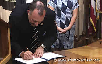 Governor signs climate change bills into law