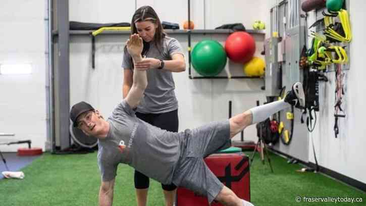 Prepping the body for the bucking; more rodeo athletes buckle down