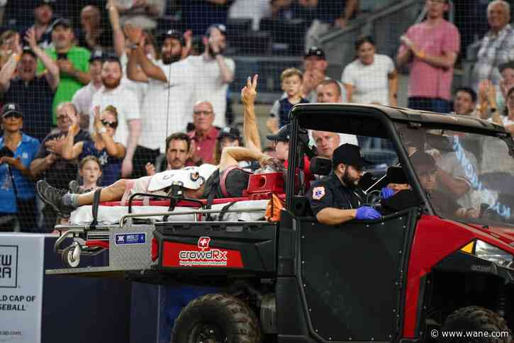 Cameraman at MLB game struck by wild throw, carted off on stretcher