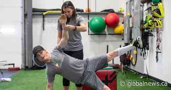 Prepping the body for the bucking; more Calgary Stampede rodeo athletes buckle down