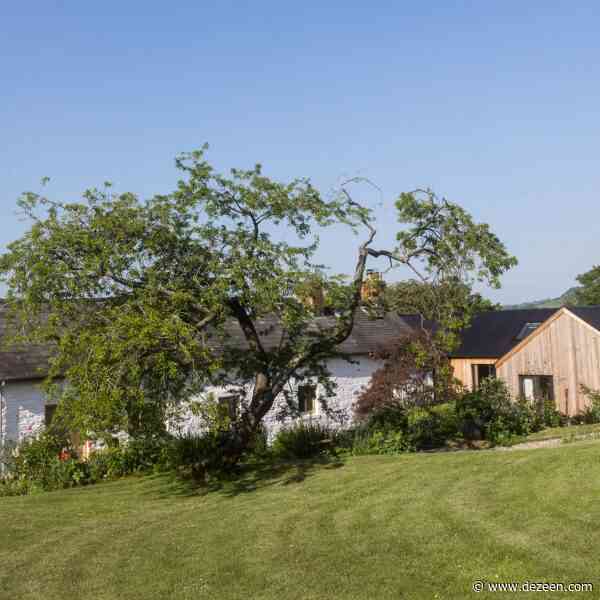 Pen y Common is a larch-clad extension to a traditional Welsh longhouse