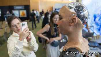 UN tech agency rolls out human-looking robots for questions at a Geneva news conference