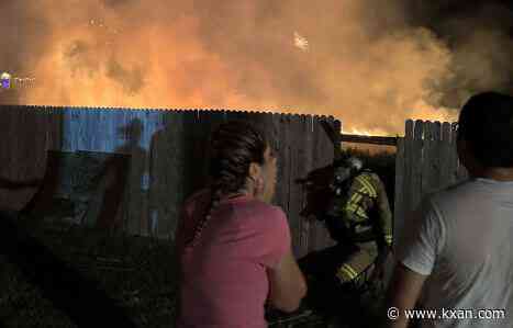 Dry field ignites close to homes during fireworks