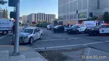 Driver crashes into Fresno police officer after running red light, officials say