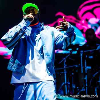 British driver joins Black Eyed Peas on stage as the party continues at Silverstone