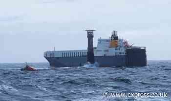 Massive cargo ship runs aground on lighthouse off Cornish coast - RNLI rush to scene