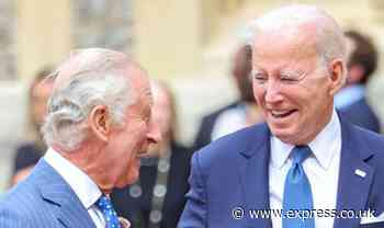 Very friendly King Charles and Biden touch one another in an 'unheard of' protocol breach