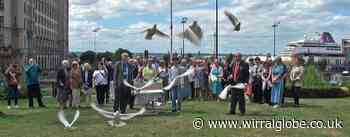 Doves fly in memory of Wirral asbestos poisoning victims