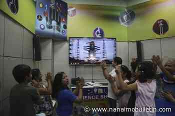 Crowds cheer as India launches a lander and rover to explore the moon’s south pole