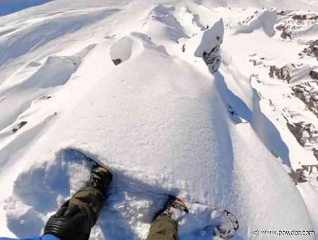 World's Best Snowboarder Carefully Balances On Narrow Spine Before Dropping In